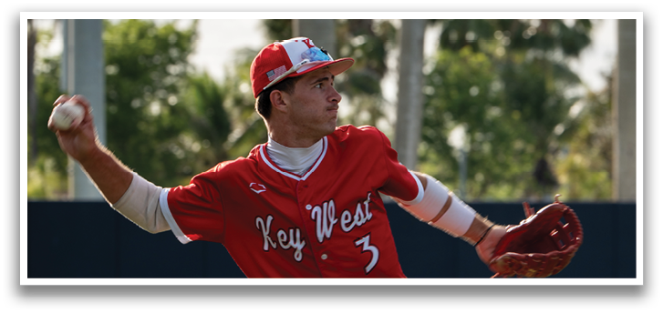A baseball player in a red uniform and white shoes. Description generated by AI