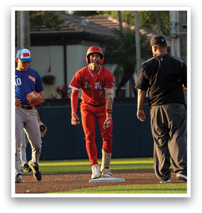 A baseball player wearing a red jersey and a helmet. Description generated by AI