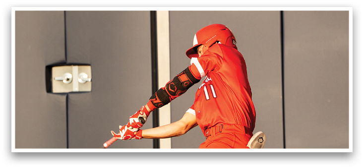 A baseball player in a red jersey is swinging a bat. Description generated by AI