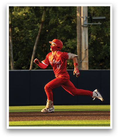 A baseball player running on the field. Description generated by AI
