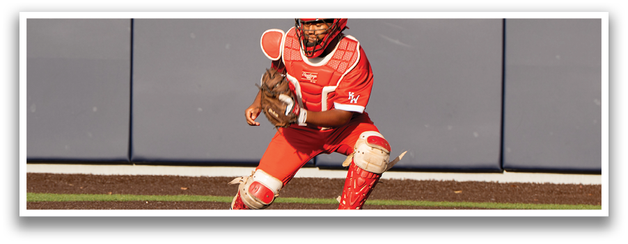 A baseball player in a red uniform is catching a ball. Description generated by AI