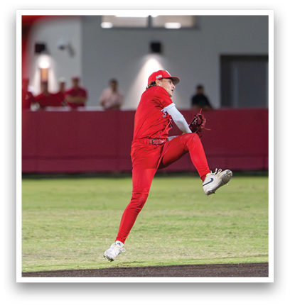 A baseball player in a red uniform is jumping in the air. Description generated by AI