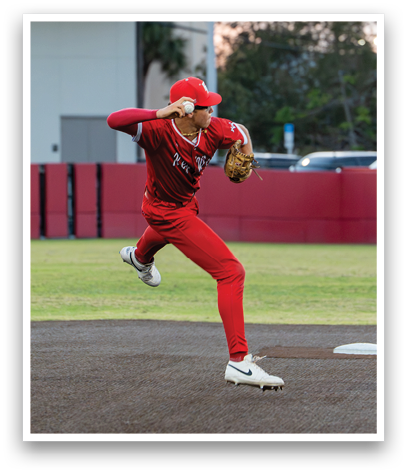 A baseball player wearing a red jersey and red pants is throwing a ball. Description generated by AI