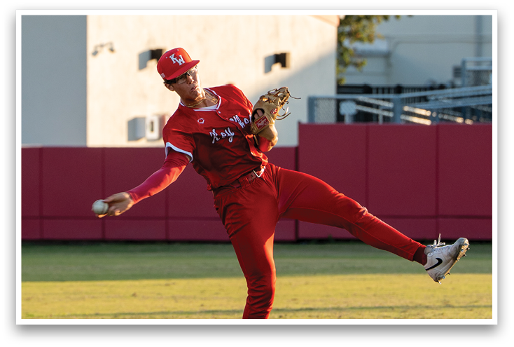 A baseball player in a red uniform is throwing a ball. Description generated by AI