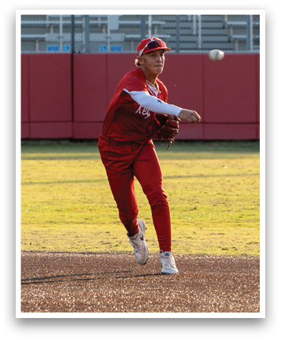 A baseball player in a red uniform is throwing a ball. Description generated by AI