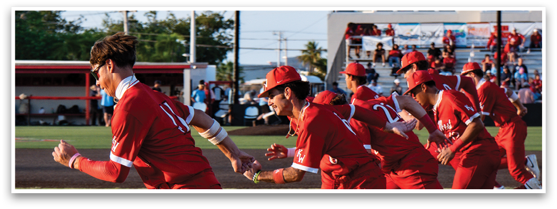 A group of people wearing red uniforms are running on a field. Description generated by AI
