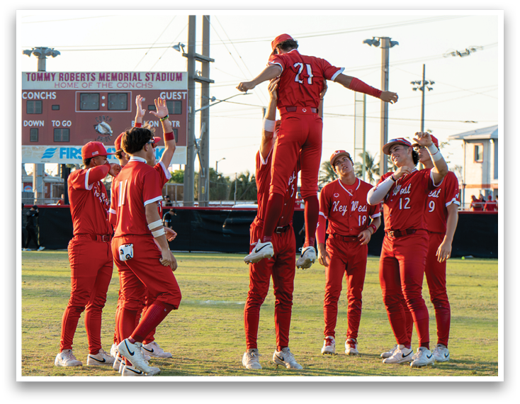 A group of people wearing red and white uniforms. Description generated by AI