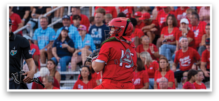 A baseball player in a red jersey is swinging a bat. Description generated by AI