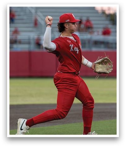 A baseball player in a red uniform is throwing a ball. Description generated by AI