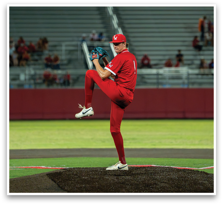 A man in a red shirt and red pants is pitching a baseball. Description generated by AI