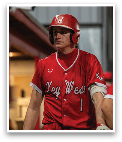 A baseball player wearing a red jersey with the number 1 on it. Description generated by AI