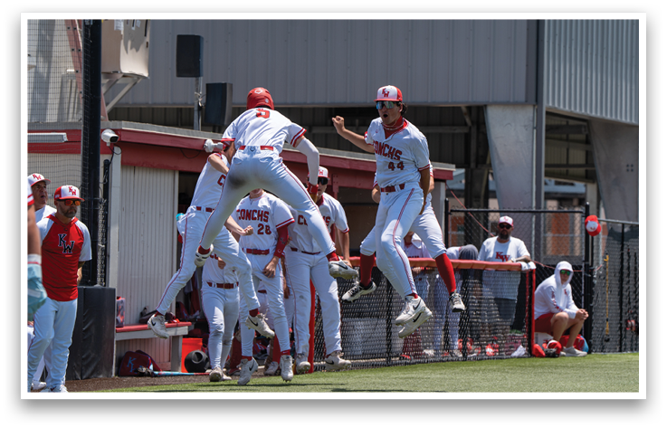 Baseball players celebrating on the field. Description generated by AI