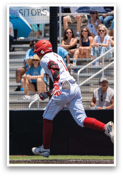 A baseball player running to the base. Description generated by AI