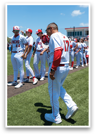 A group of baseball players walking on a field. Description generated by AI