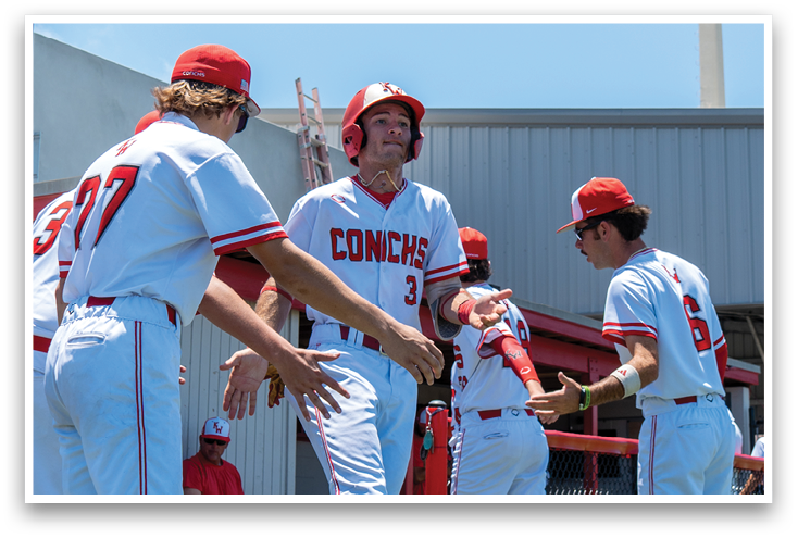 A group of baseball players on a field. Description generated by AI