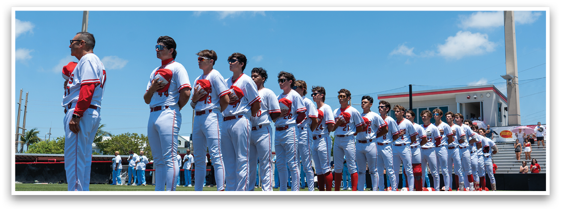 Baseball players standing on a field. Description generated by AI