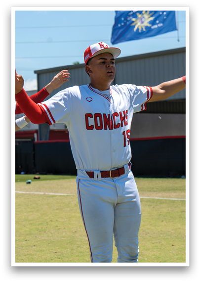 A baseball player wearing a white and red uniform with the number 11 on the back. Description generated by AI