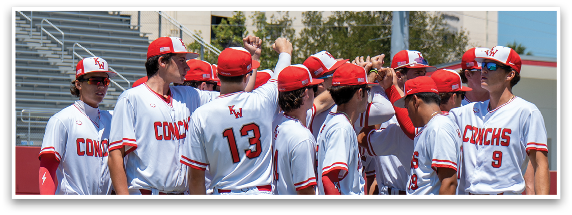 Baseball players wearing red and white uniforms. Description generated by AI