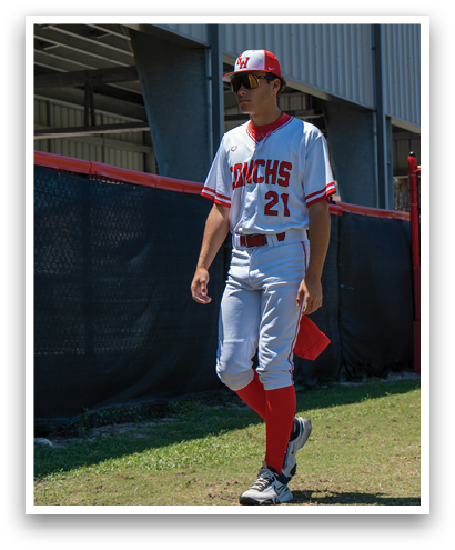 A baseball player wearing a red sock and a red and white uniform. Description generated by AI