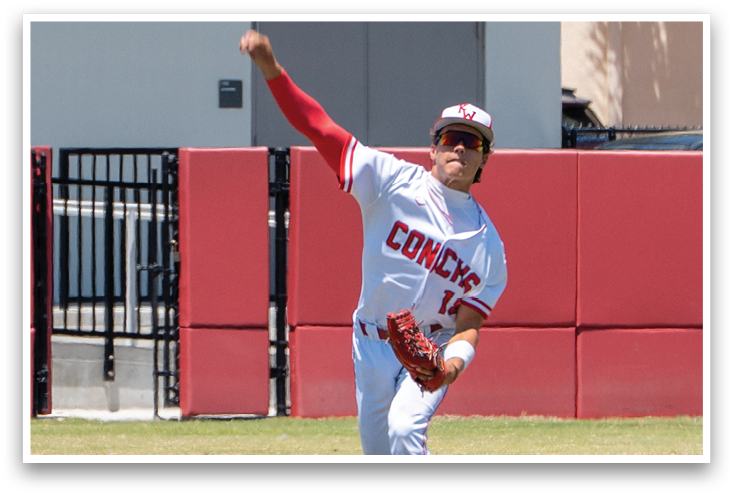A baseball player in a white uniform is throwing a ball. Description generated by AI