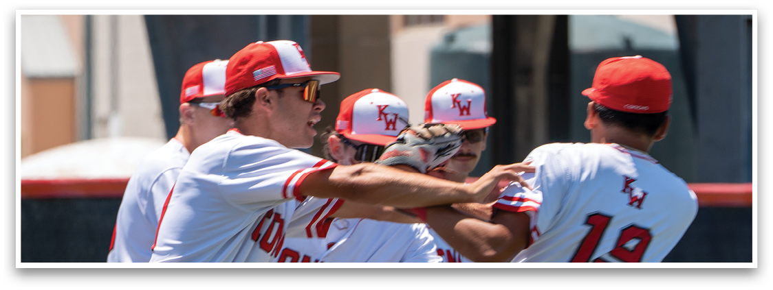 A group of men wearing red and white uniforms are celebrating on a baseball field. Description generated by AI