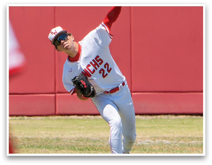 A baseball player in a white uniform with the number 22 on the back of it. Description generated by AI