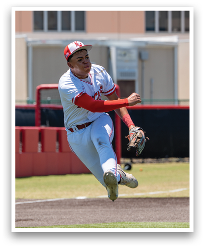 A baseball player in a white uniform is jumping in the air to catch a ball. Description generated by AI