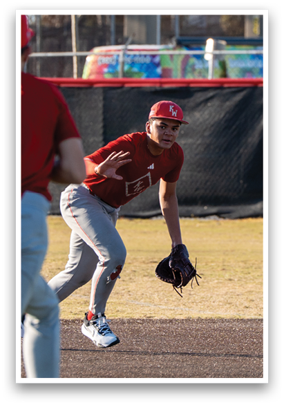 Two baseball players are on the field, one wearing a red shirt and the other wearing a grey shirt. The red shirt player is holding a baseball glove and appears to be ready to catch the ball. AI generated content