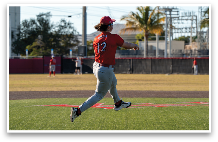 A baseball player in a red shirt and grey pants is throwing a ball on a field. AI generated content