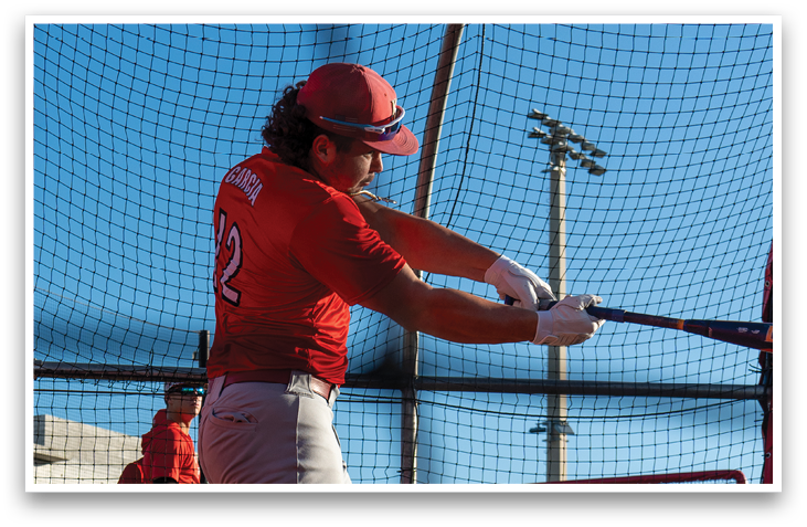 A baseball player in a red shirt and white hat is swinging a bat at a ball. AI generated content