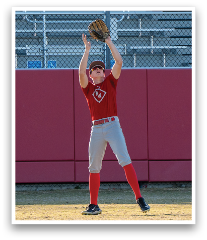 A baseball player wearing a red shirt and grey pants is catching a ball in his glove. AI generated content