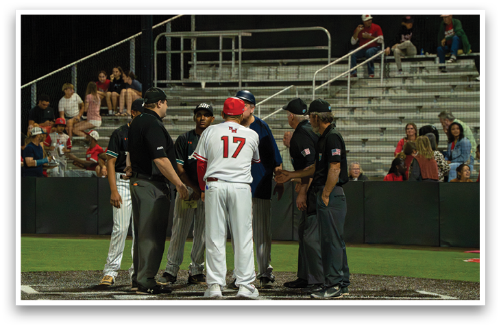 A group of men wearing baseball uniforms shake hands on a baseball field. AI generated content
