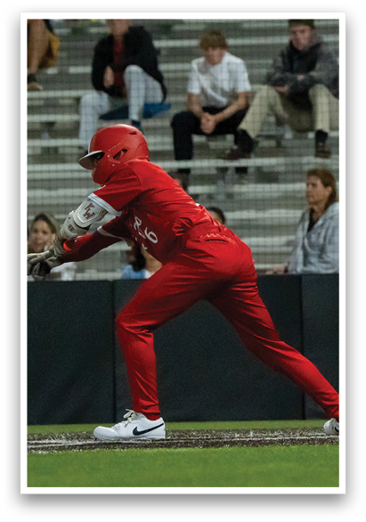 A baseball player in a red uniform is swinging a bat, while a catcher and an umpire watch. AI generated content