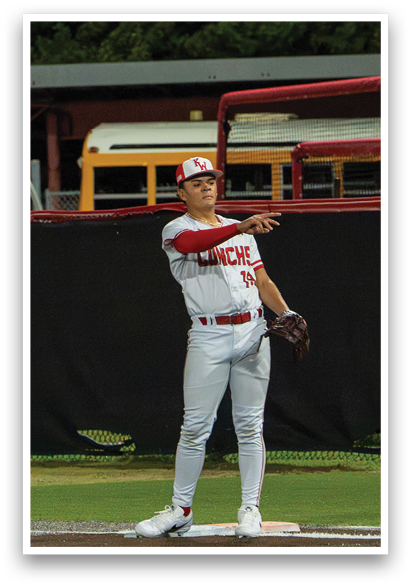 A baseball player in a white uniform is standing on the field, holding a baseball glove and preparing to catch a ball. AI generated content