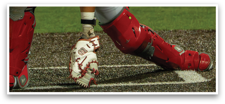 A baseball player is sliding into home plate, wearing a catcher's mitt. AI generated content