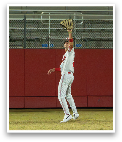 A baseball player catching a ball in a stadium. AI generated content