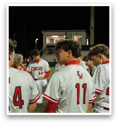 A group of baseball players wearing white uniforms are standing on a field. AI generated content