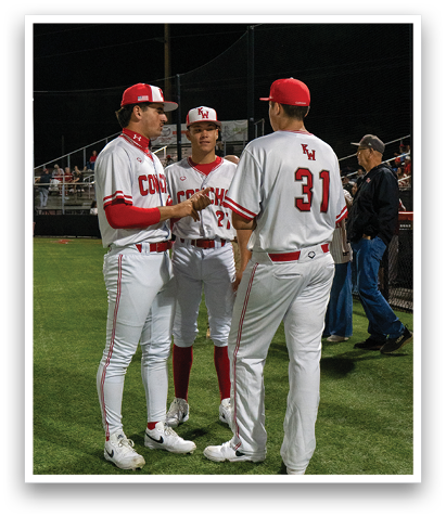 Three baseball players wearing white uniforms are standing on a field, talking to each other. AI generated content
