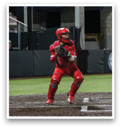 A baseball player in a red uniform is holding a baseball glove and preparing to catch a ball. AI generated content