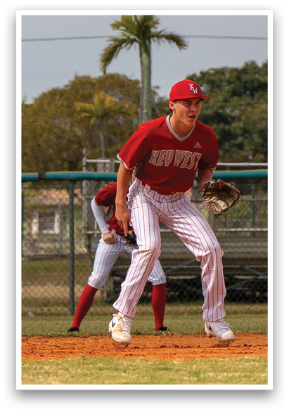 A baseball player in a red shirt and white pants is standing on the field, holding a baseball glove. AI generated content