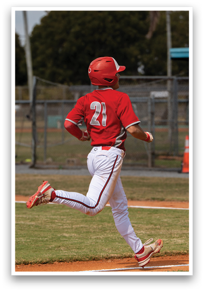 A baseball player wearing a red helmet and red and white uniform is running on the field. AI generated content