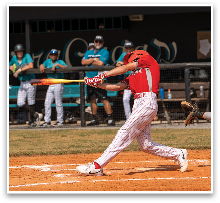 A baseball player in a red shirt and white pants is swinging a bat at a ball. AI generated content