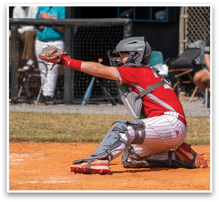 A baseball player is in the process of catching a ball. AI generated content