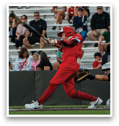 A baseball player in a red uniform is swinging a bat, with a crowd of people watching from the stands. AI generated content