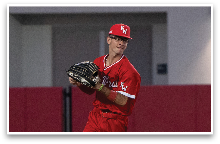 A baseball player wearing a red jersey and holding a baseball glove. AI generated content