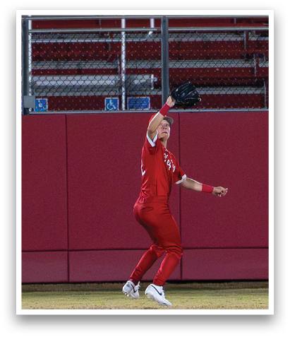 A woman wearing a red outfit is catching a ball. AI generated content