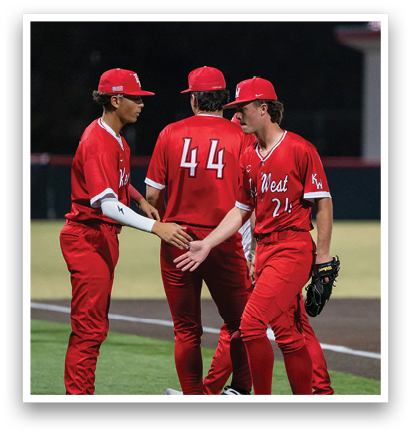 Three baseball players wearing red uniforms are shaking hands on the field. AI generated content