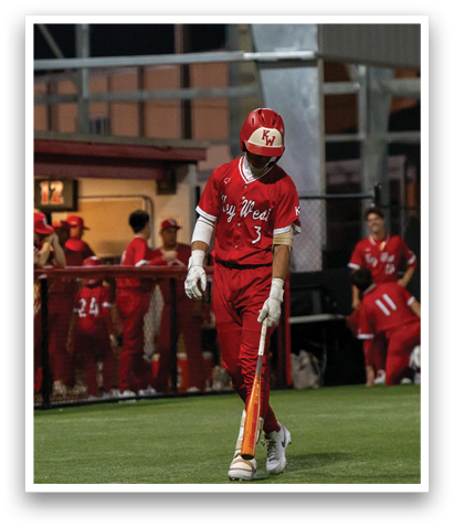 A baseball player in a red uniform holding a bat. AI generated content