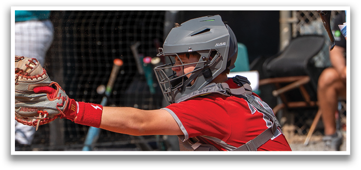 A baseball player is kneeling on the ground, wearing a catcher's mitt and ready to catch the ball. AI generated content