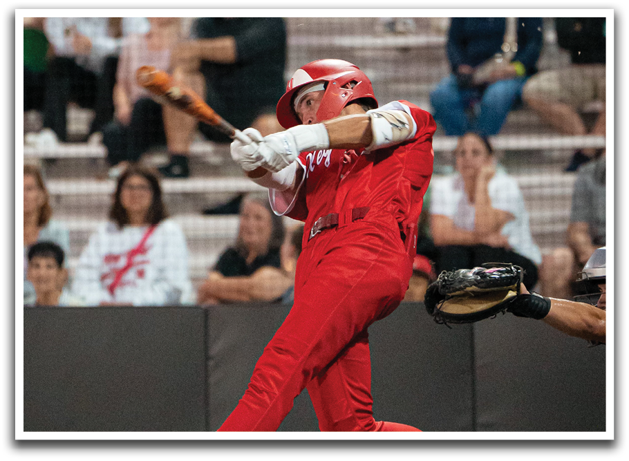 A baseball player in a red jersey is swinging a bat, with a crowd of people watching. AI generated content